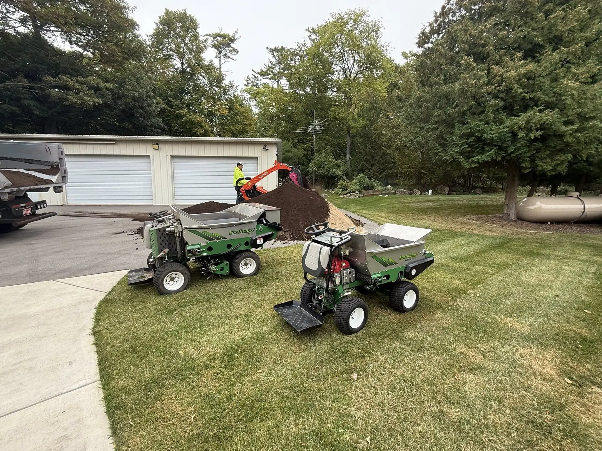 Earth and Turf 100 SP walk-behind top dressing machine available for rent from Crappy Lawn Care